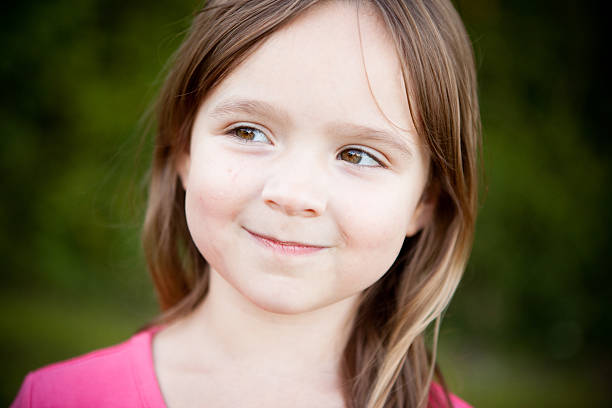 istock Happy Young Girl Smiling Outside 182444349