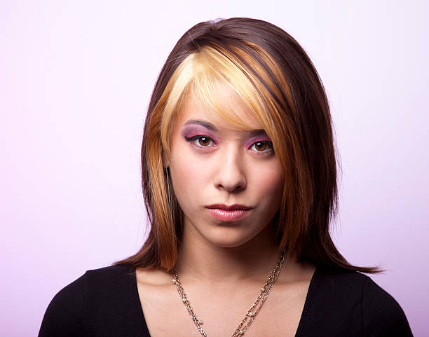 Young Woman with Serious Expression stock photo