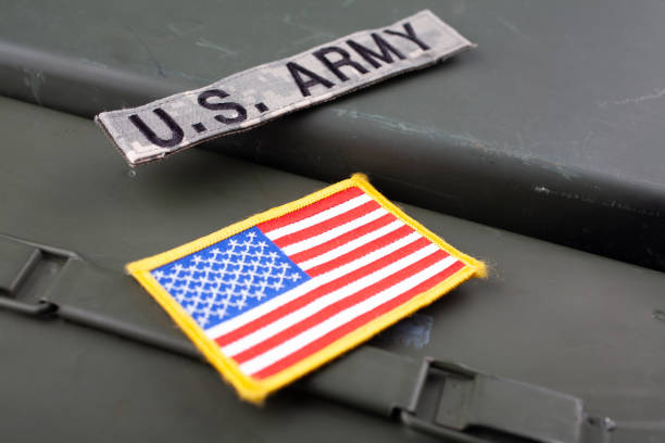istock US ARMY Branch Tape with national US flag patch on green ammo can 1824451014