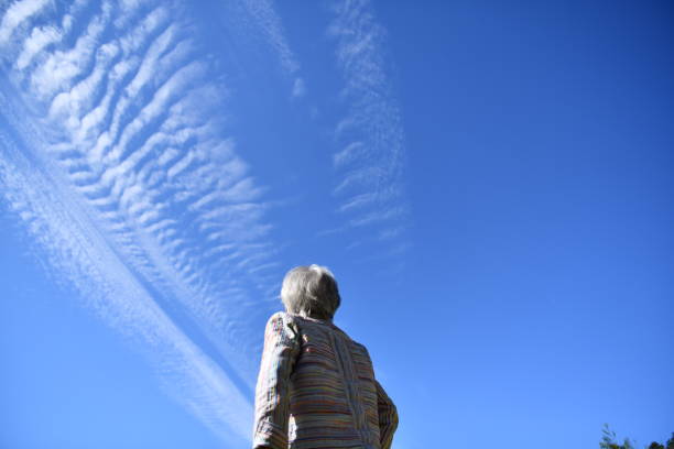 istock Senior woman looking at the blue sky 1824456357