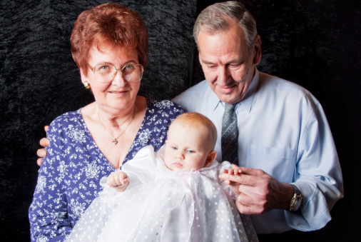 proud and loving grandparents with with granddaughter in baptism dresshere you can see more of my  pics about