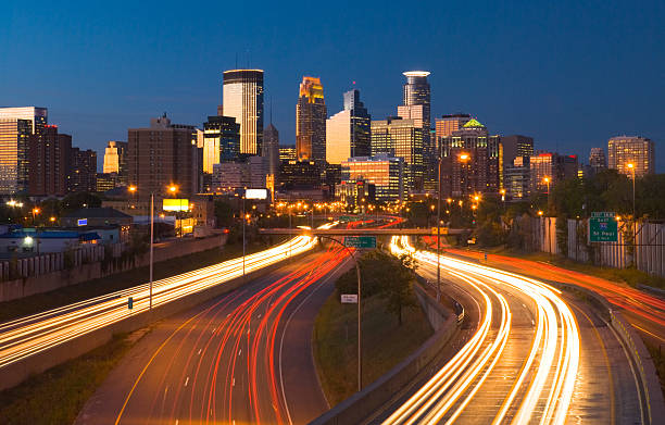 istock Minneapolis skyline and highway at dusk 182445957