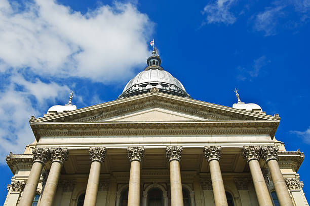 Illinois State Capital Building Low view looking up at Illinois State Capital Building with blue sky and clouds illinois state capitol stock pictures, royalty-free photos & images