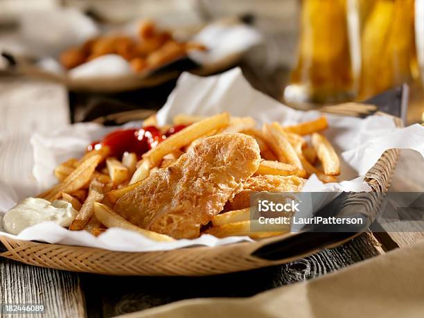 Fish And Chips With A Beer Stock Photo - Download Image Now - Fish and Chips, Indoors, Alcohol - Drink