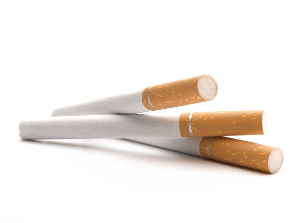 Three cigarettes on a white background stock photo