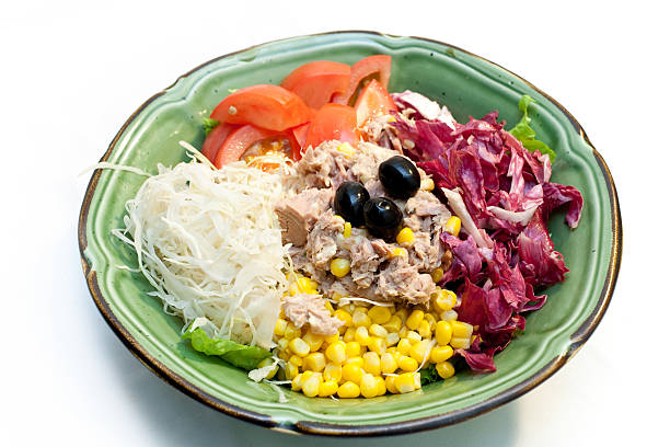 Tuna fish salad "Salad wth tuna, cabbage, lettuce, corn,tomato, ..." caesar salad food salad tuna stock pictures, royalty-free photos & images