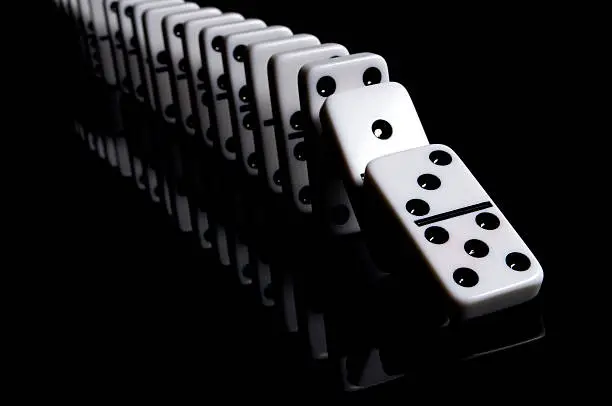"White dominos on a reflective, black background. Other images in this series:"