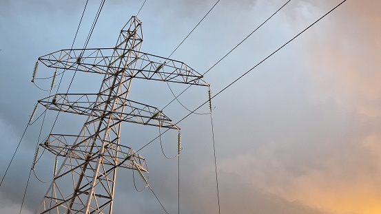 Electricity pylon against wintry sky