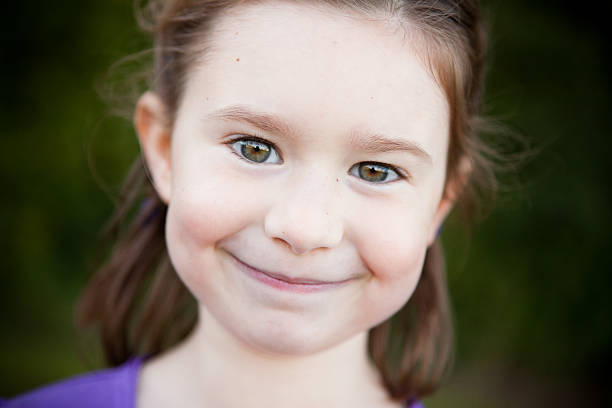 istock Happy Young Girl Smiling Outside 182454356