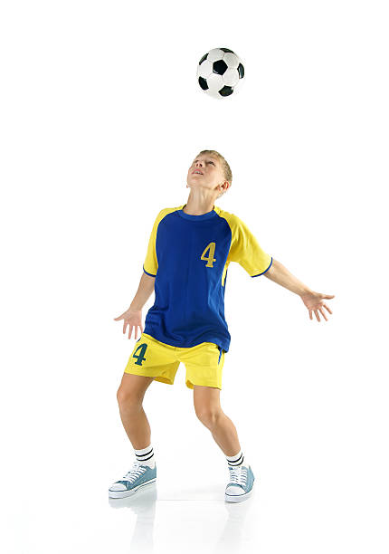 Boy with soccer ball isolated on a white