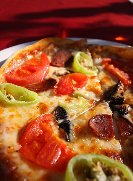 istock Close up on a slice of pizza - natural light 182455074