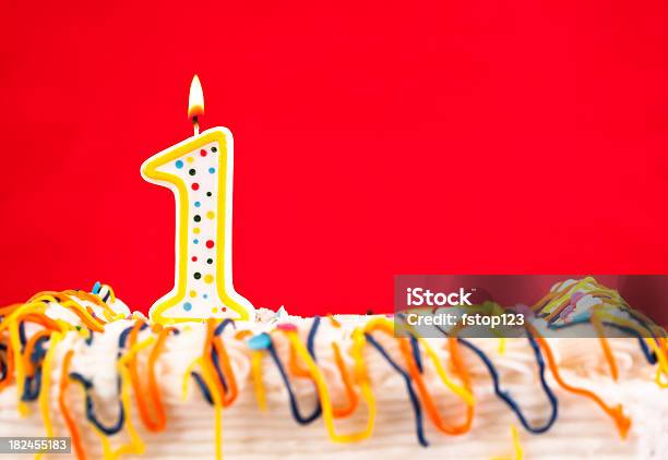 Decorated Birthday Cake With Number 1 Burning Candle Red Background Stock Photo - Download Image Now