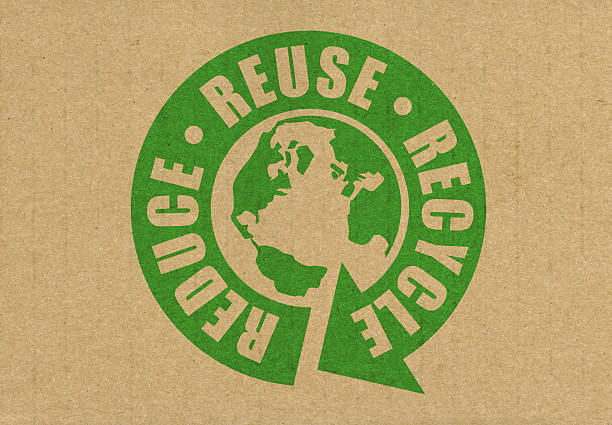 Recycling symbol made of paper on blue background. Horizontal composition with copy space. Green energy concept.