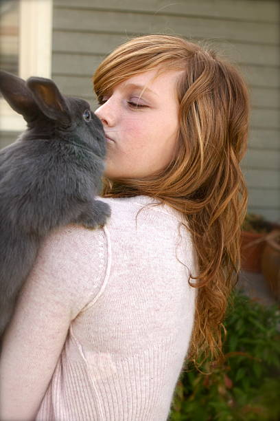 istock Girl Kissing Rabbit 182455563