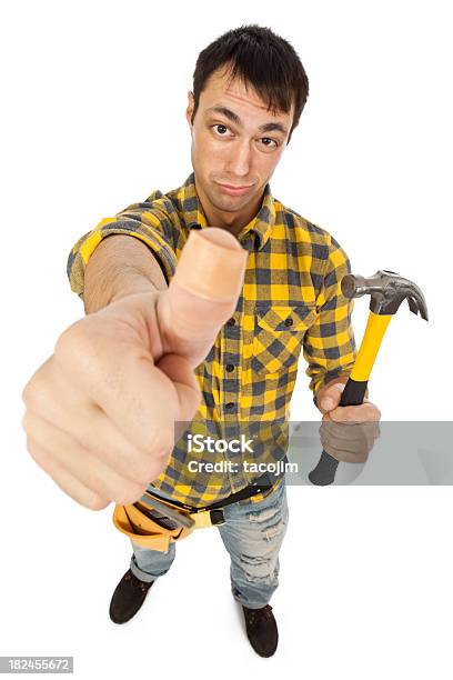 Carpenter With Bandaid On Thumb Stock Photo - Download Image Now - Humor, Hammer, Repairperson - Occupation