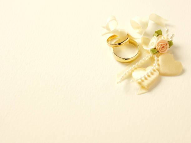 Male and female gold wedding rings with fabric rose and hearts. Copy spaceClick on the link below to see more of my wedding and party image.