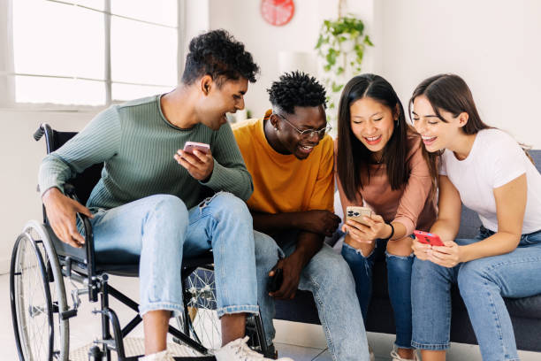 istock Group of diverse teenage people using smart mobile phone together at home 1824560607