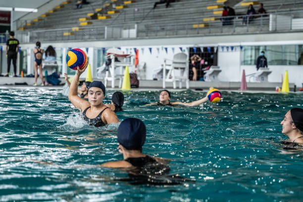 Teen boy playing above and underwater