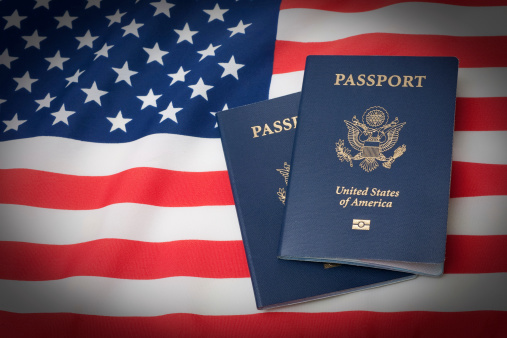 U.S. Passports on an American Stars and Stripes flag. Some vignetting was added.