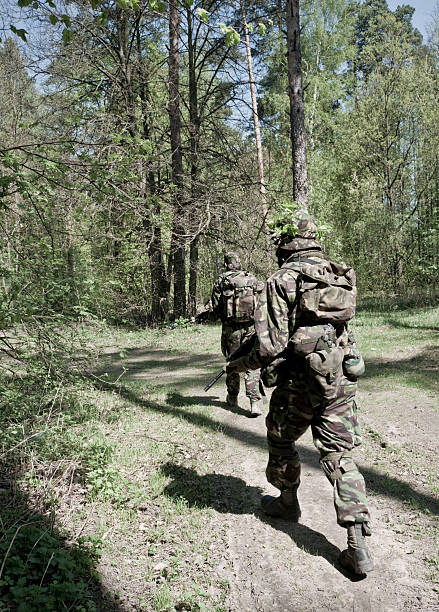 istock soldiers in a forest 182457179