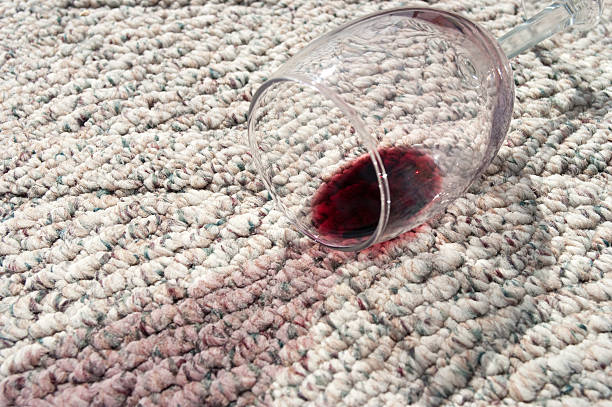 istock Spilled glass of red wine on carpet 182457254