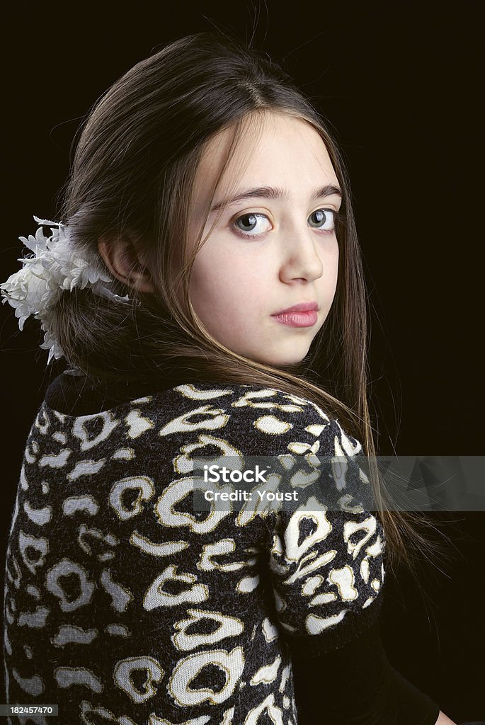 Girl child looking backwards Cute girl child looking backwards 10-11 Years Stock Photo