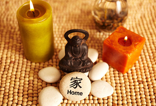 istock Spa still life buddha statue and candles, home pebble 182457514