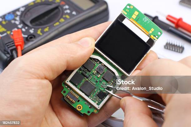 Electronic Technician Gsm Stock Photo - Download Image Now - Blue-collar Worker, CPU, Capacitor