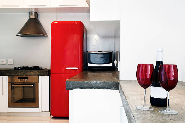 istock Red fridge and wine glasses in domestic kitchen 182457851