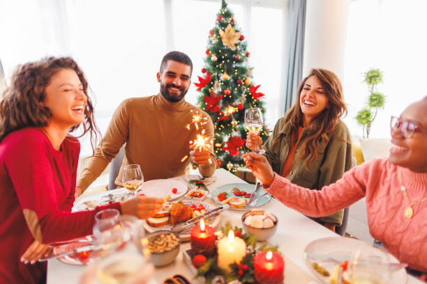 istock Friends holding sparklers while having Christmas dinner 1824580016