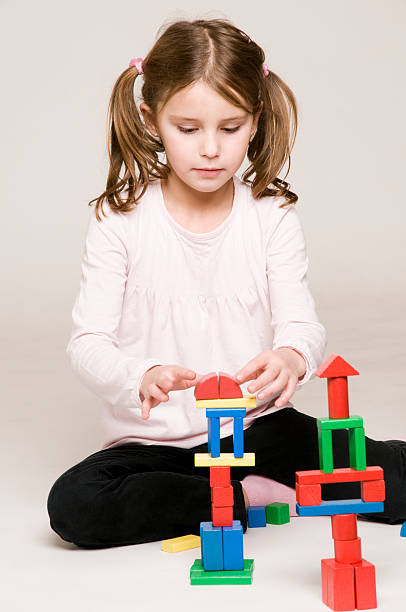 istock little girl playing 182458106