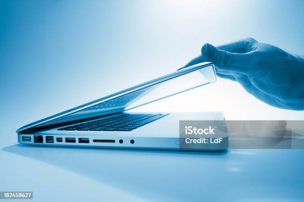 Hand Opening A Contemporary Laptop Computer Stock Photo - Download Image Now - Laptop, Closing, Opening