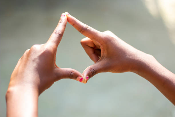 istock A man made love sign with hands and blurred background 1824587232