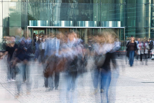 istock Blurred Office Workers Walking in Font of Financial Building 182458938