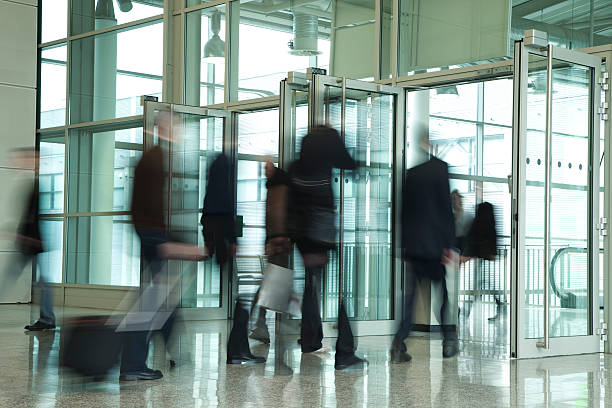 istock Business People Walking Through Glass Doors, Blurred Motion 182459055