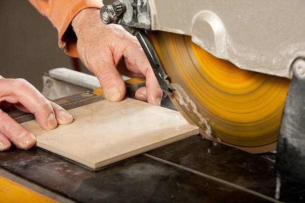 cutting tile with a wet saw stock photo