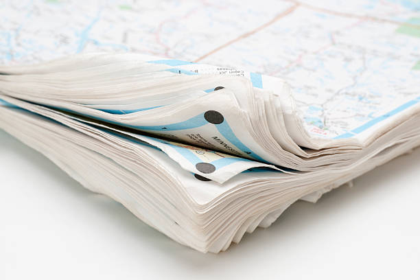 istock curled corner of old road map atlas 182459356