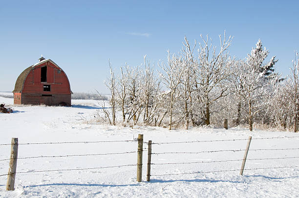 istock Winter Scene with Red Barn and Fence  ... Distant 182459384
