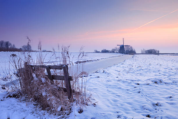 Cold winter sunset with a beautiful factory at the background