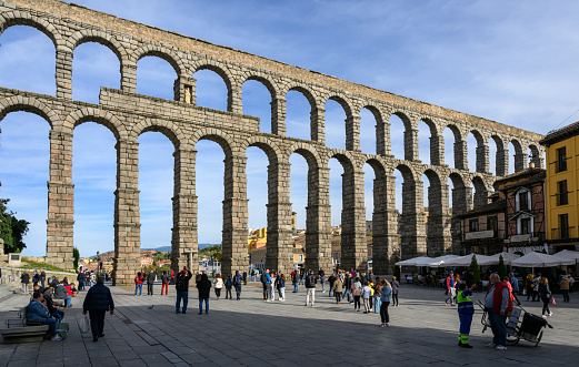 Segovia, Spain - Oct 31, 2023: Roman aqueduct of Segovia on sunny day afternoon.