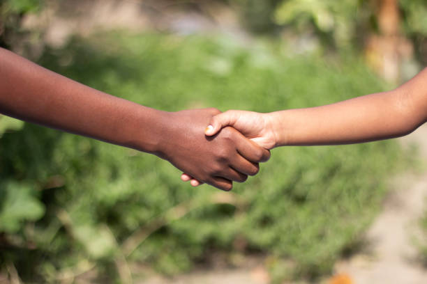 istock A man shaking hands with another man and blurred background 1824595757