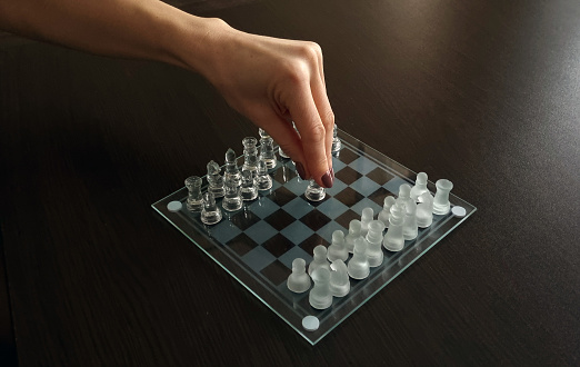Close up shot of the chess board made of glass