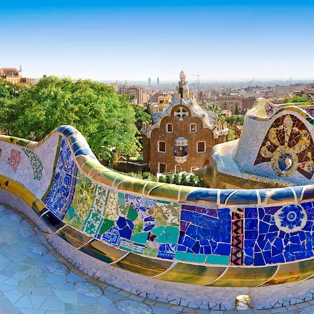 The stunningly vibrant colours and twisting shapes of the Spanish architect Gaudi's famous Parc Guell in Barcelona, Spain.