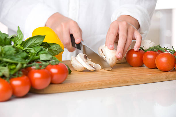 istock close up of hands chopping food 182460246