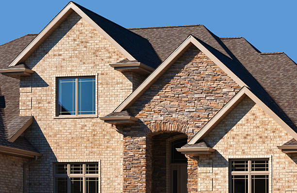 istock Brick and Stone Home With Gabled Roof, Asphalt Shingles 182460630