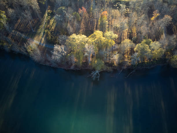istock Overhead view of curved riverbank with footpath and long shadows 1824606785