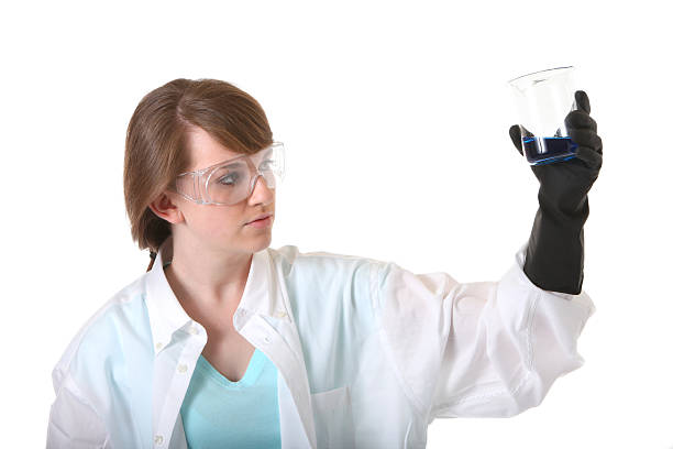 istock young woman looking at beaker 182460784