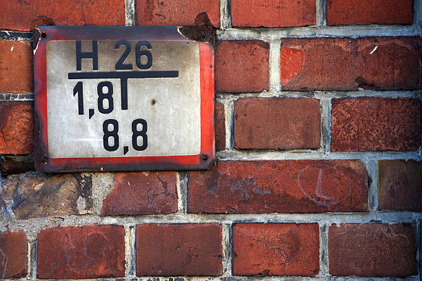 Old fire plate on the wall of brick