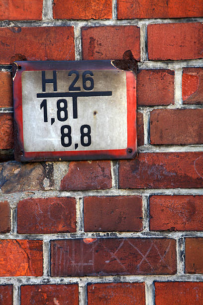 istock Old fire plate on the wall of brick 182461038