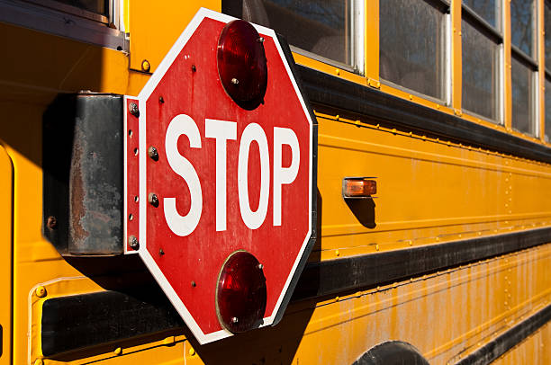istock Stop sign on side of yellow school bus 182461176